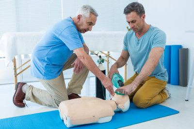 man teaching how to CPR